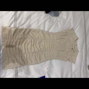 Beige dress with ruching and bow detail
